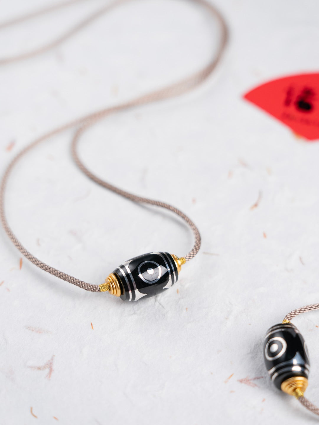 Silver-Inlaid Dzi Bead Pendant